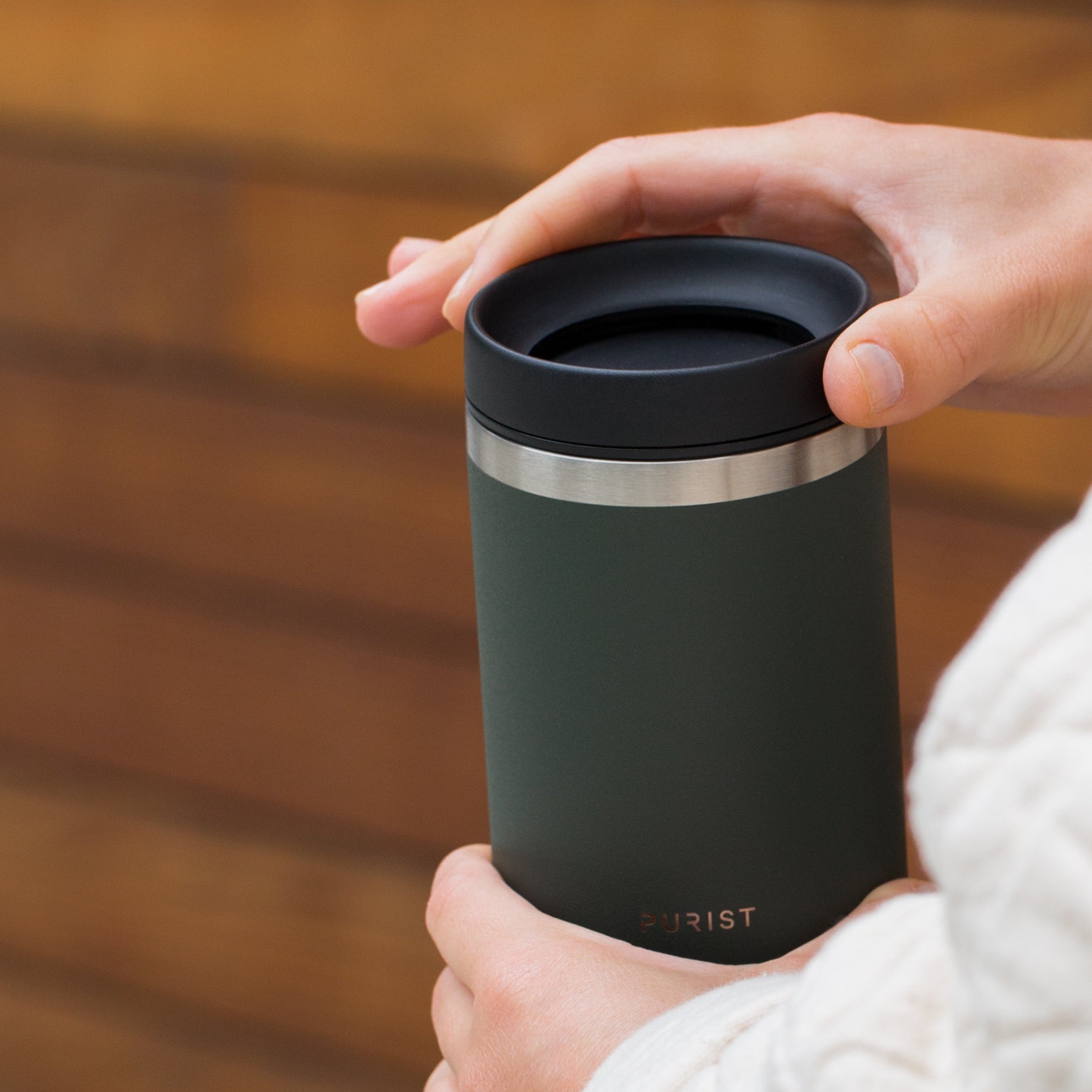 Photo of person opening Purist Collective Maker and Scope Lid in Ever.